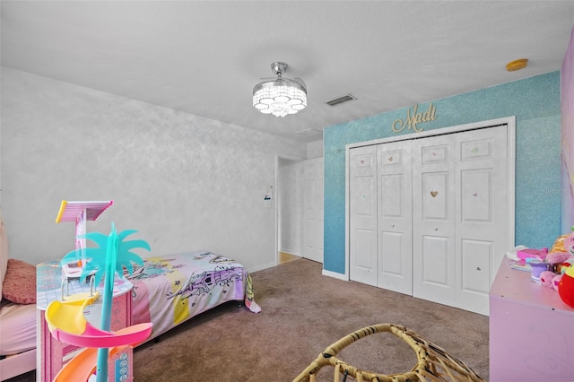 carpeted bedroom featuring a closet