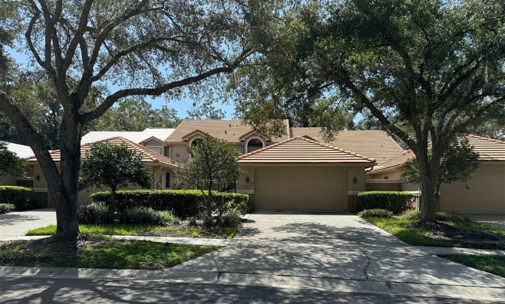 ranch-style home featuring a garage