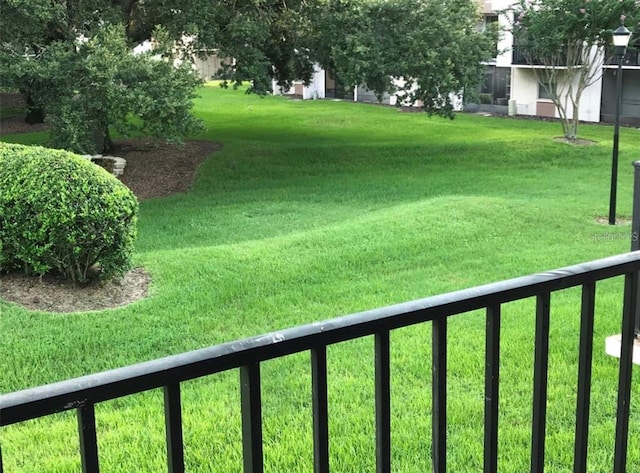 view of yard featuring a balcony