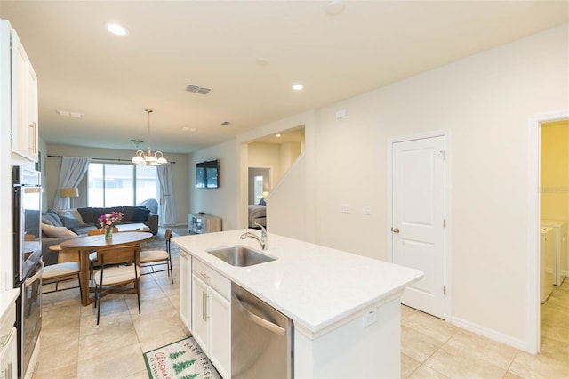 kitchen with white cabinets, sink, an island with sink, and appliances with stainless steel finishes