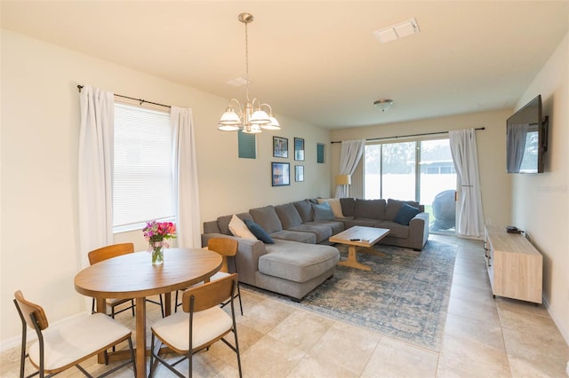 living room with a notable chandelier