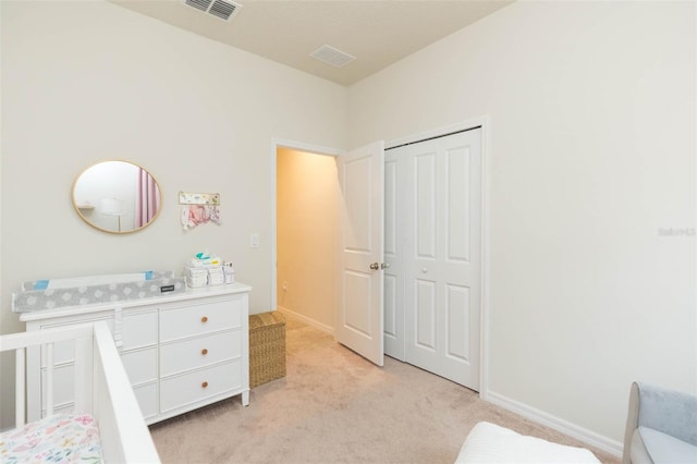 carpeted bedroom with a closet