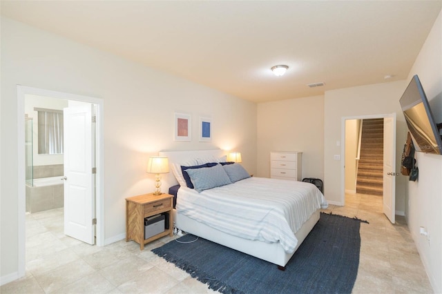 bedroom featuring ensuite bathroom