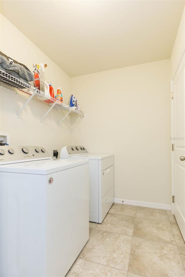 washroom with washing machine and dryer