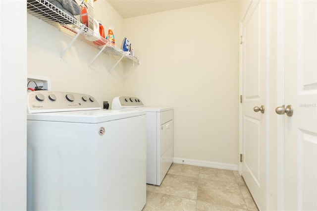 washroom featuring washing machine and clothes dryer