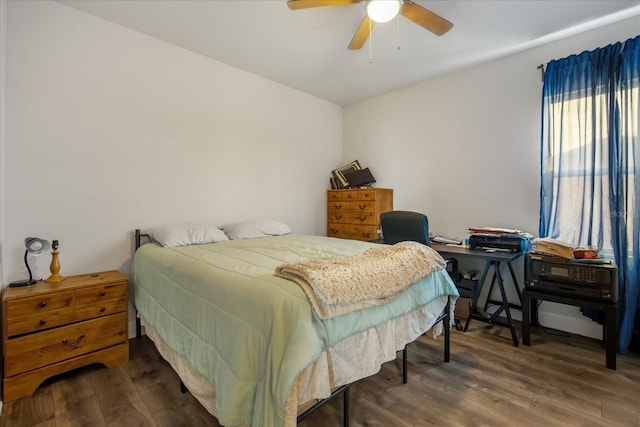 bedroom with dark wood-type flooring and ceiling fan