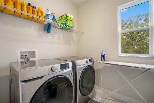 laundry room featuring washing machine and clothes dryer