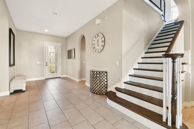 foyer entrance with light tile patterned floors