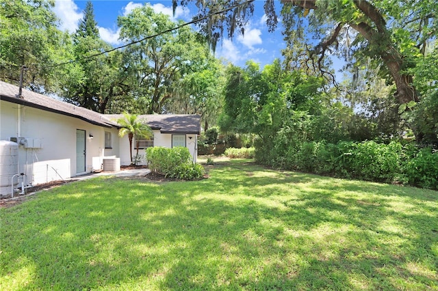 view of yard featuring central AC