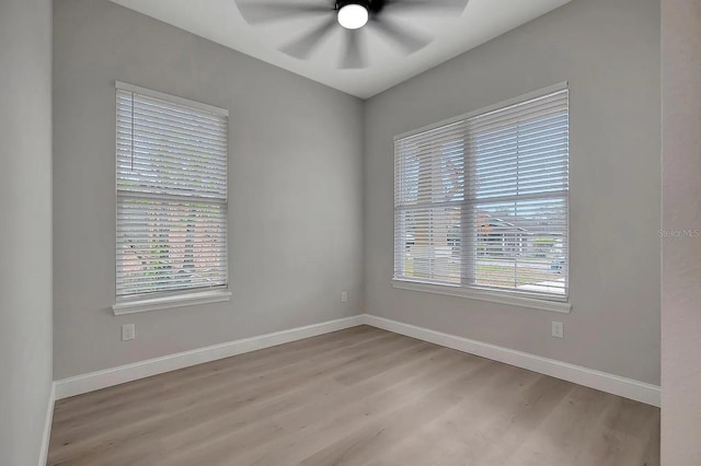 unfurnished room featuring ceiling fan, a healthy amount of sunlight, and light hardwood / wood-style flooring