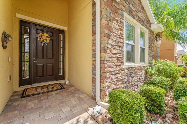 doorway to property featuring a porch