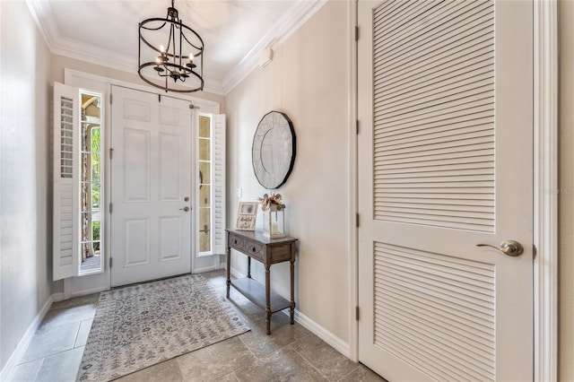 tiled foyer entrance with crown molding and an inviting chandelier