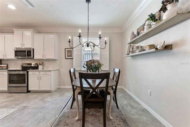 dining space with light tile patterned flooring, ornamental molding, and a notable chandelier