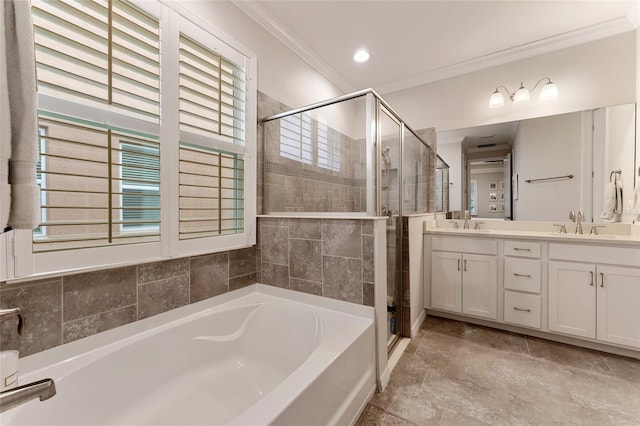 bathroom with dual vanity, a wealth of natural light, ornamental molding, and tile patterned flooring