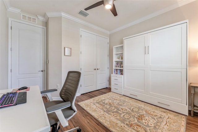 home office with ceiling fan, crown molding, and wood-type flooring