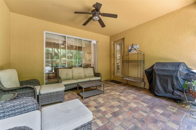 view of patio / terrace with ceiling fan and an outdoor living space