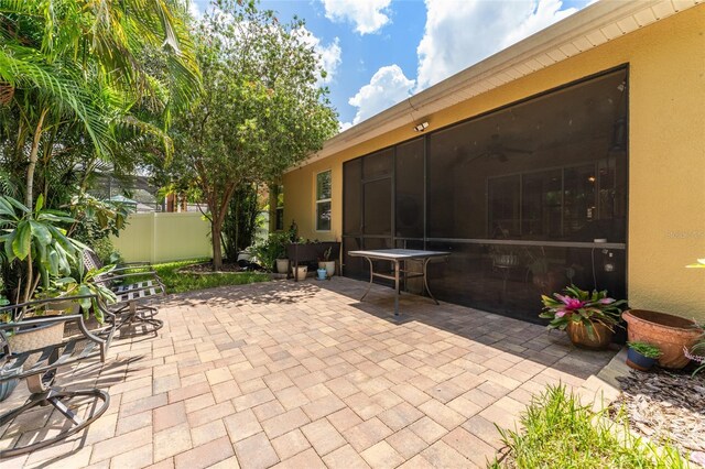 view of patio / terrace with a sunroom