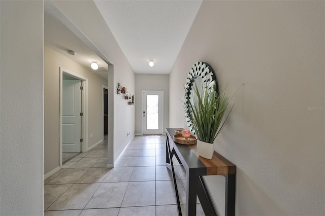 entryway with light tile patterned floors