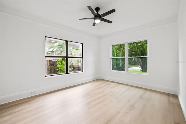 unfurnished room featuring ceiling fan, crown molding, and light hardwood / wood-style floors