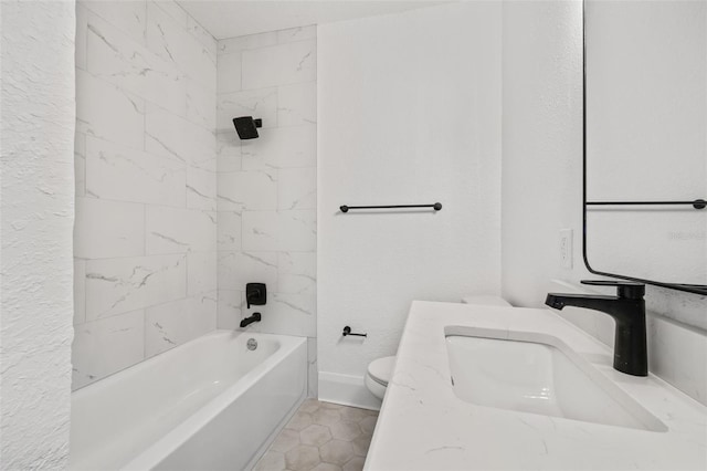 full bathroom with toilet, tiled shower / bath combo, vanity, and tile patterned flooring