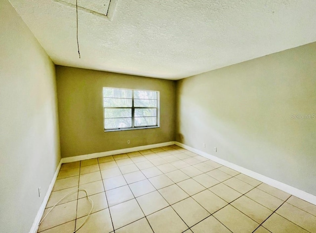 empty room featuring a textured ceiling