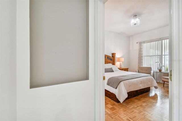 bedroom featuring light parquet floors