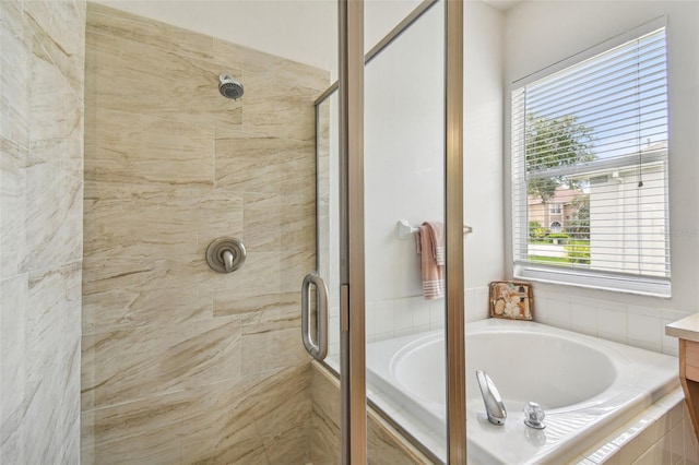 bathroom with vanity and separate shower and tub