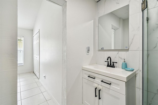 bathroom with tile patterned flooring and vanity