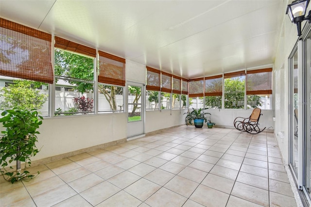 unfurnished sunroom with a healthy amount of sunlight