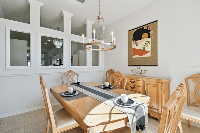 dining area with a chandelier and light tile patterned flooring