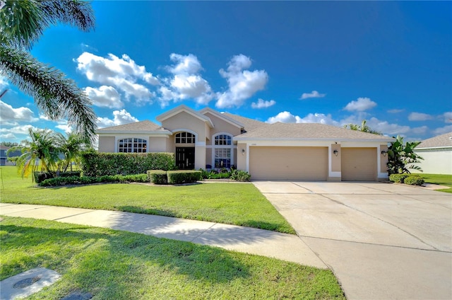 view of front facade with a front yard and a garage