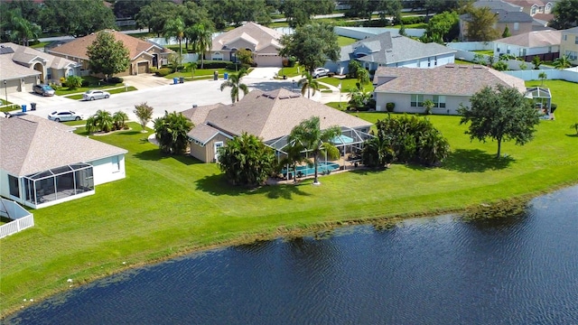 birds eye view of property with a water view