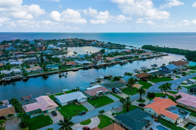 birds eye view of property featuring a water view