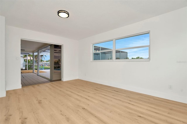 spare room with light wood-type flooring