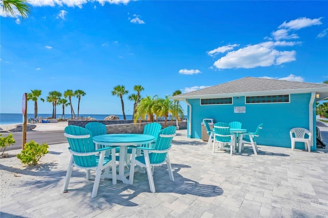 view of patio with a water view