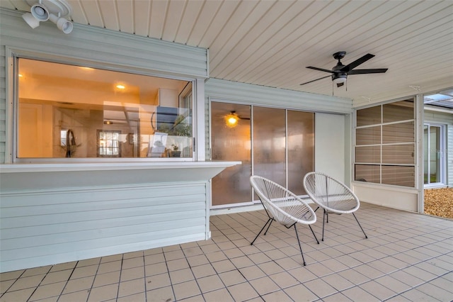 view of patio / terrace featuring ceiling fan