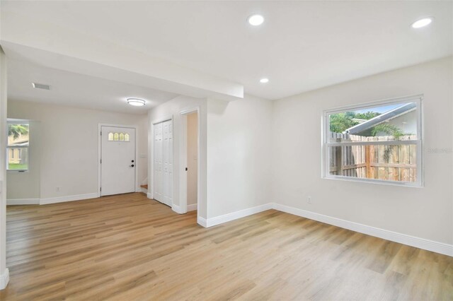 unfurnished room with light hardwood / wood-style flooring