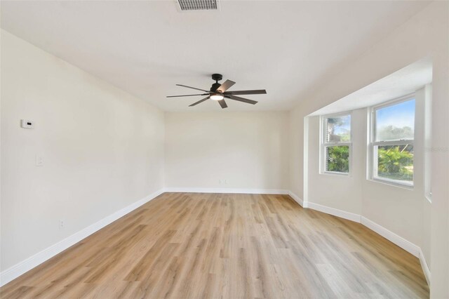 unfurnished room with ceiling fan and light wood-type flooring