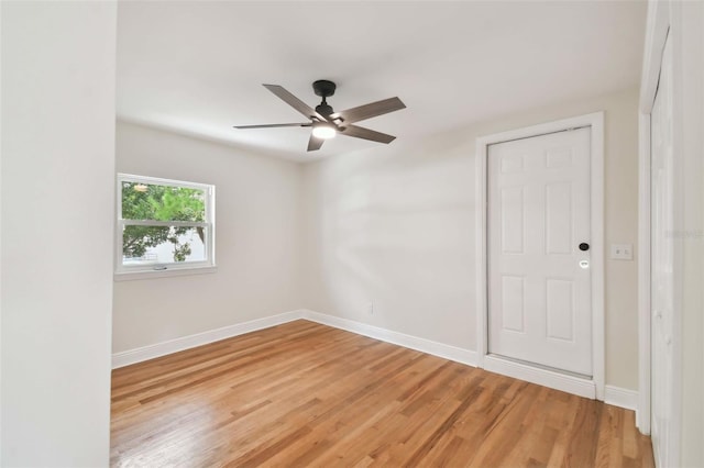 unfurnished room with wood-type flooring and ceiling fan