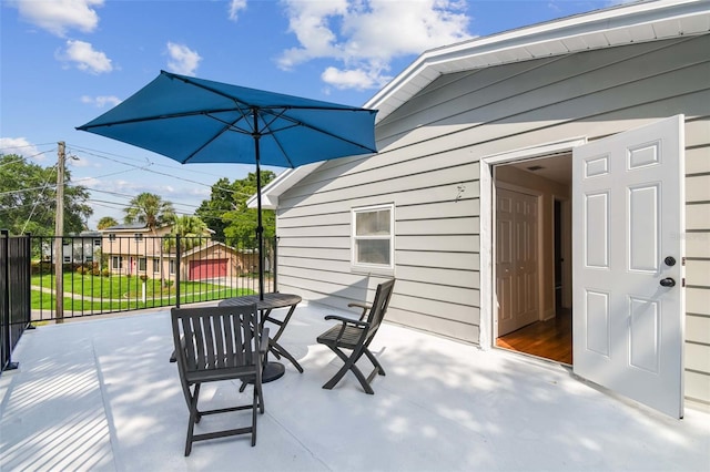 view of patio / terrace featuring fence