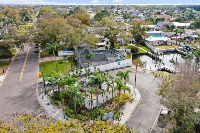 bird's eye view with a water view and a residential view