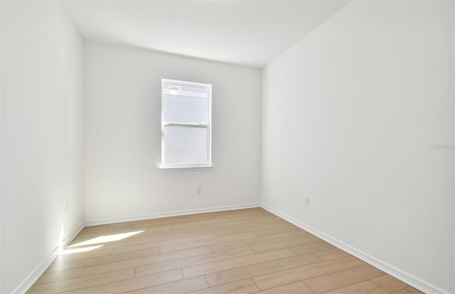 spare room with light wood-type flooring