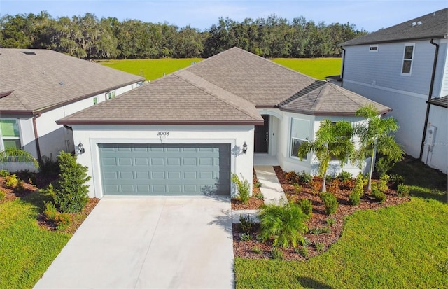 view of front facade with a garage and a front yard