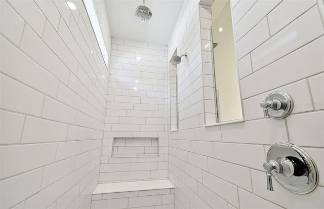 bathroom with tiled shower