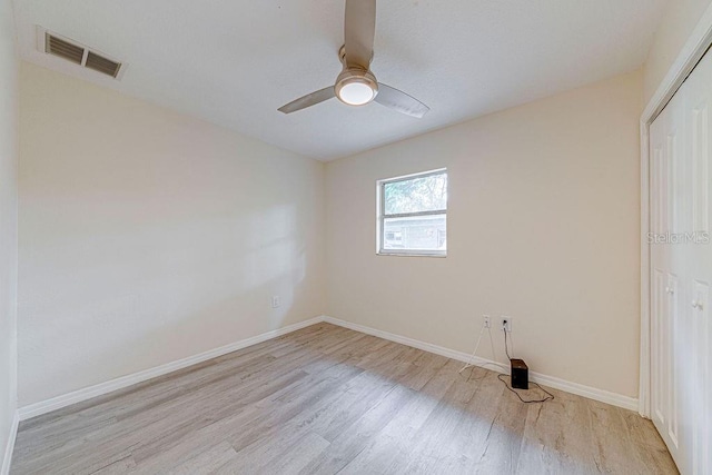 unfurnished bedroom with ceiling fan and light hardwood / wood-style floors