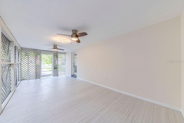 unfurnished room with ceiling fan