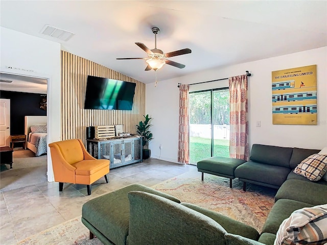 living area featuring visible vents and a ceiling fan