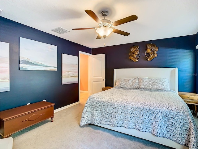 bedroom with carpet, visible vents, ceiling fan, and baseboards