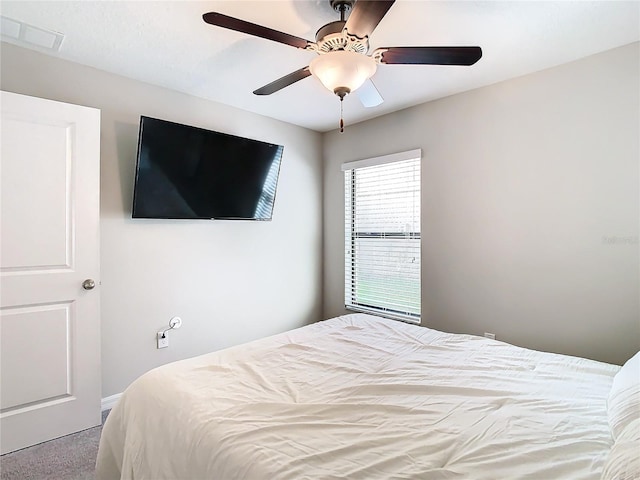 bedroom featuring ceiling fan, visible vents, and carpet flooring