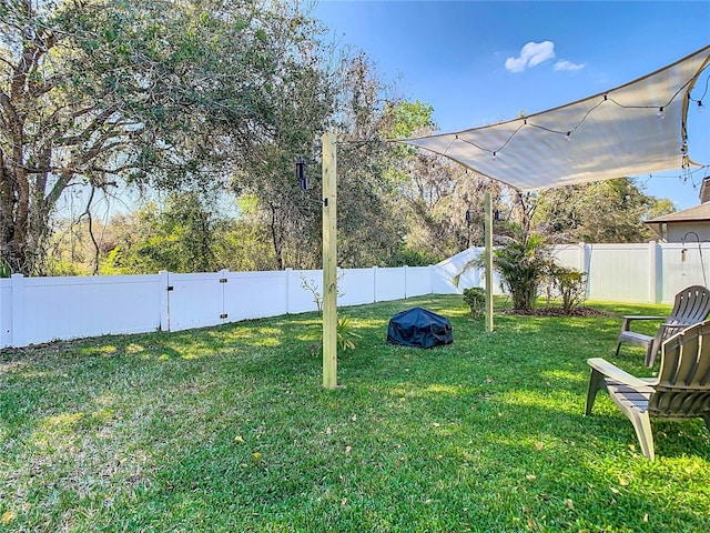 view of yard with a fenced backyard